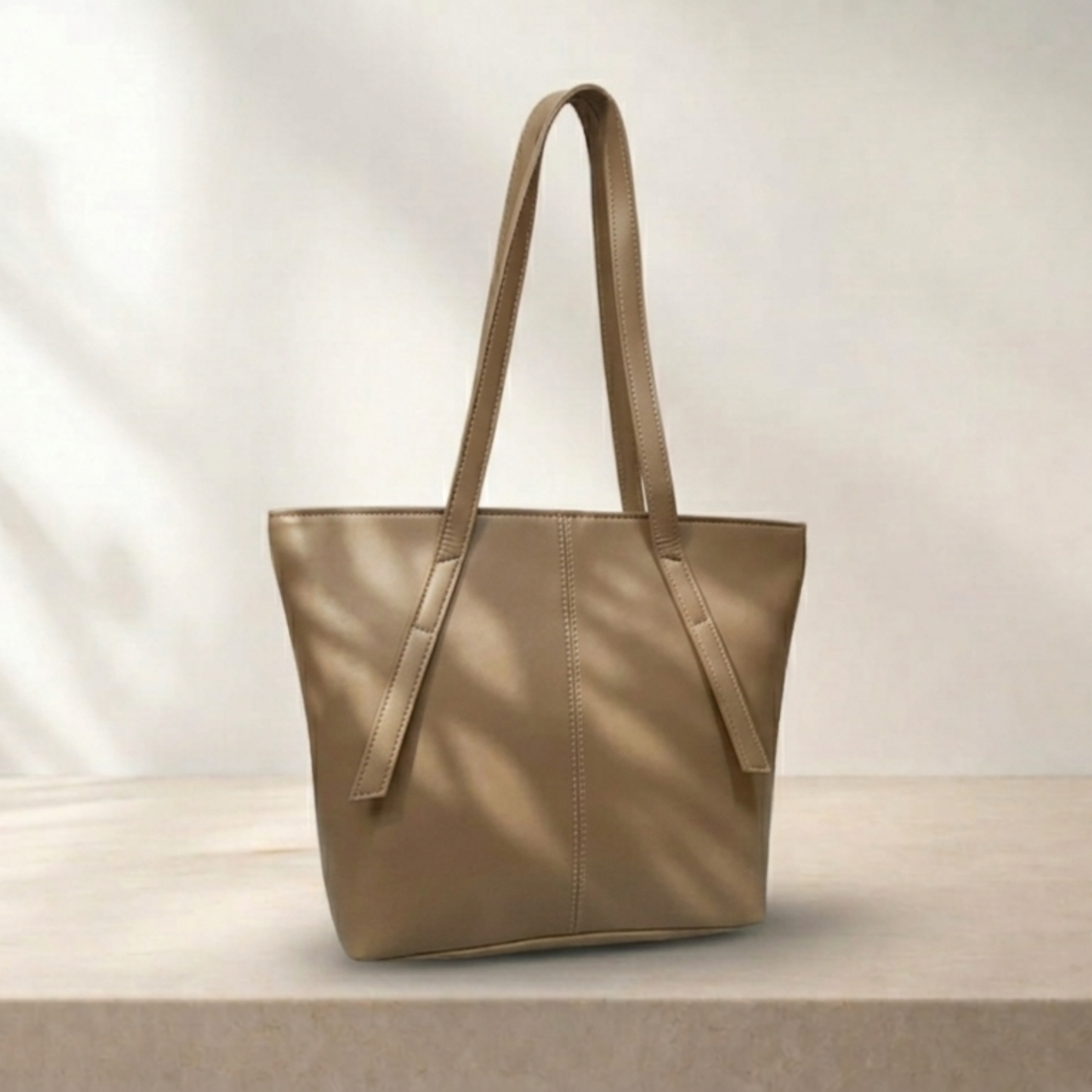 Beige tote bag on a light wooden surface with a neutral background