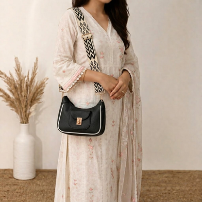 Woman holding a black handbag with a white background
