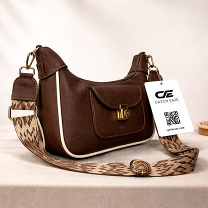 Brown handbag with a leopard print strap and Catch Eaze tag on a light background